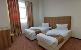 سوئیت یک خوابه چهار نفره (دوتخته توئین+کاناپه تخت شو) (اقامت بدون صبحانه)